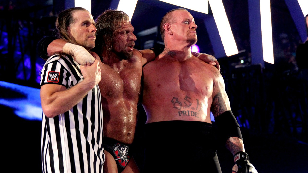 Resultado de imagem para wwe wrestlemania 28 HHH, HBK and Undertaker at stage